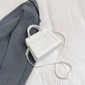 Minimalist white structured handbag with transparent PVC front pocket and top handle - White