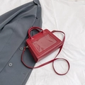 Chic vibrant red faux leather crossbody bag with a clear PVC front pocket display - Red