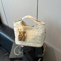 White pleated bucket handbag with bear charm and adjustable crossbody strap for women - With Pendant / White