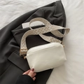 White minimalist crossbody camera bag with a wide geometric patterned shoulder strap - White