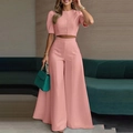 Elegantes rosa Zweiteiler-Set mit kurzärmeligem Crop-Top mit Knöpfen und Hose mit weitem Bein - S / Rosa