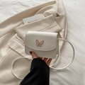 Mini borsa a tracolla bianco crema con farfalla dorata e cinturino sottile - Bianco