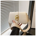 Close-up of cream leather bag featuring a gold D-buckle and textured knit strap - White