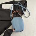 Light blue denim bucket bag with kiss-lock closure and brown leather top handle - Light Blue
