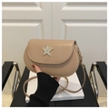 Detail view of beige saddle bag with sparkling rhinestone star buckle and fine strap - Khaki
