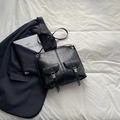 Chic black motorcycle style backpack with dual front utility pockets and metal buckles - Black