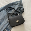 Chic black textured crossbody bag with silver rhinestone star and elegant chain strap - Black