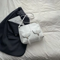 White minimalist motorcycle-style faux leather backpack with silver hardware - White
