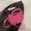 Retro geometric embossed pink handbag with circular handle and crossbody strap - Pink