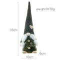 Standing green Christmas gnome plush with snowflake patterns and heart hat detail - Green