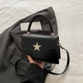Chic black faux leather square crossbody bag with star emblem and round top handle - Black