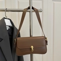 Retro brown leather underarm bag for women with a gold cylindrical buckle closure - Brown