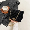 Black velvet crossbody bag with V-shaped quilting and golden chain strap detail - Black