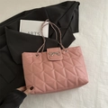 Quilted pink tote bag with silver metal bow and chain shoulder strap for women - Pink