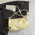 Fashionable light yellow dumpling underarm bag with unique knotted strap and leather texture - Yellow Without Pendant