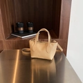 Minimalist light brown pebbled leather bucket bag with top handles and adjustable strap - Khaki