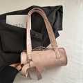 Pink cylinder baguette bag with a stylish bow knot and dual shoulder straps - Pink