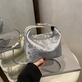 Silver snakeskin textured pillow bag with metallic finish and gold buckle detail - Silver