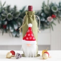 Christmas burlap wine bottle cover featuring a green gnome with a red snowflake hat - Style B / Green