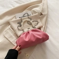 Pink pleated cloud clutch with pearl handle and silver chain strap on beige blazer - Rose Pink