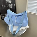 Minimalist light blue nylon crescent shoulder bag with wide strap and round coin purse - Blue