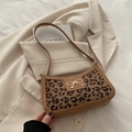 Leopard print crossbody bag with bow buckle and brown leather trim detailing - Khaki