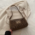 Brown faux leather shoulder bag with leopard print panel and golden bow buckle - Brown