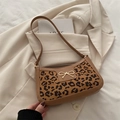 Brown leopard print underarm bag with golden bow and elegant crocodile texture finish - Brown
