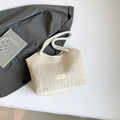 Chic cream woven tote bag with thick cotton rope handles and leather trim accents - White