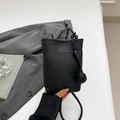 Black litchi grain leather crossbody bag with a unique knotted shoulder strap detail - Black