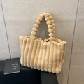 Light brown plush tote bag with vertical pleated texture and unique faux fur ball chain handle - Khaki