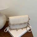 Summer woven straw crossbody bag with shell charms and flap cover in resort style - White