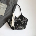Quilted black tote bag with colorful zigzag embroidery and stylish long shoulder straps - Black