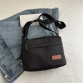 Sac bandoulière unisexe en nylon noir avec plusieurs compartiments et sangle réglable - Noir