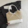 Straw and white leather tote bag with elegant bow detail for a chic summer style - White