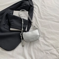 Silver lychee pattern crescent bag with sleek metallic finish and long knot shoulder strap - Silver