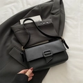 Elegant black pebble leather underarm bag with a stylish buckle for modern women - Black