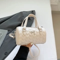 Beige Boston handbag with heart quilting pattern, silver bow detail and shoulder strap - Off White
