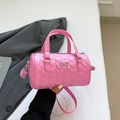 Pink heart quilted boston bag with silver bow detail and detachable shoulder strap - Pink