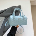Light blue barrel bag with heart quilting, gold bow detail and top handles - Blue