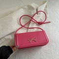 Chic bright pink underarm bag with a golden bow buckle and slim shoulder strap - Pink