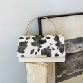 Chic white crossbody bag with cow print flap and golden metal ring handle - White
