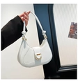 Close-up of white leather underarm bag with gold D-ring buckle and knotted strap - White