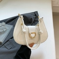 Elegant white crescent shoulder bag with gold hardware and stylish knotted handle - White