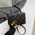 Black quilted crossbody bag with golden clasp and chain detail in stylish PU leather - Black