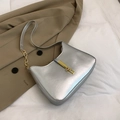 Metallic silver hobo shoulder bag with gold hardware and chain strap detail - Silver