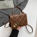 Dark brown quilted crossbody bag with golden chain and metallic square lock detail - Brown