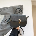 Black leather handbag with shimmering glitter flap and gold hardware for women - Black