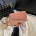 Chic pink shoulder bag with leather and woven texture, perfect for 2025 summer fashion - Pink