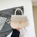 Chic beige crossbody bag with silver glitter flap and gold hardware for 2025 style - White